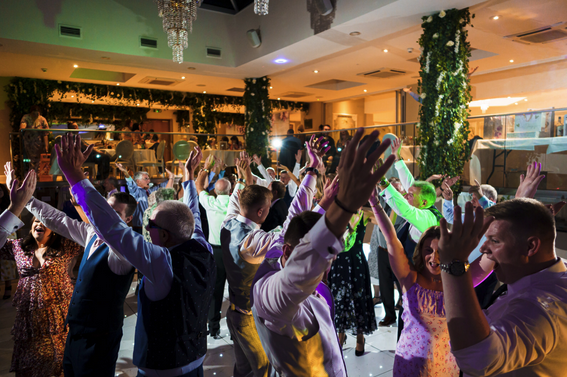 Full wedding dancefloor with DJ