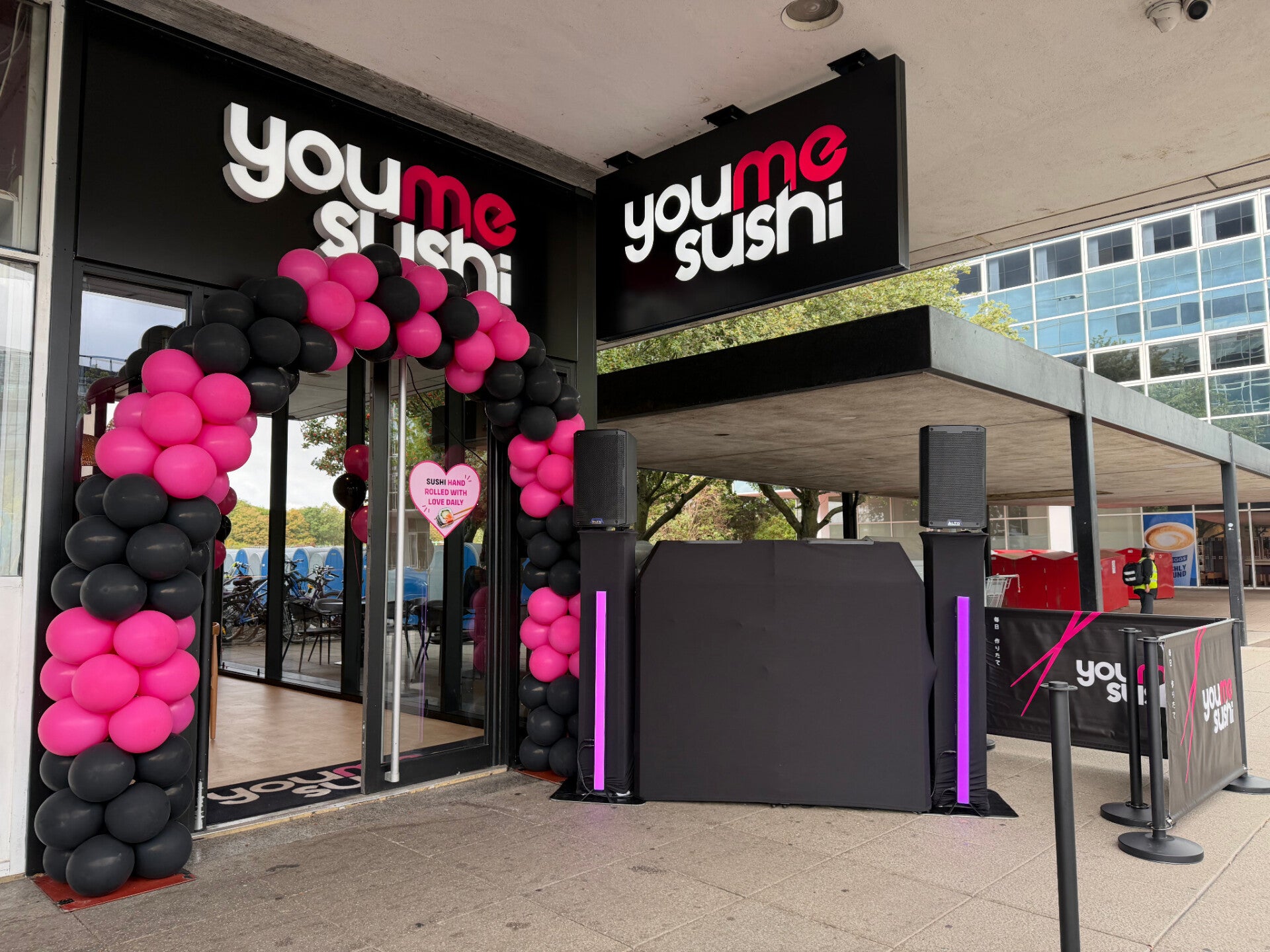 YouMeSushi launch with black MHX booth and pink light bars