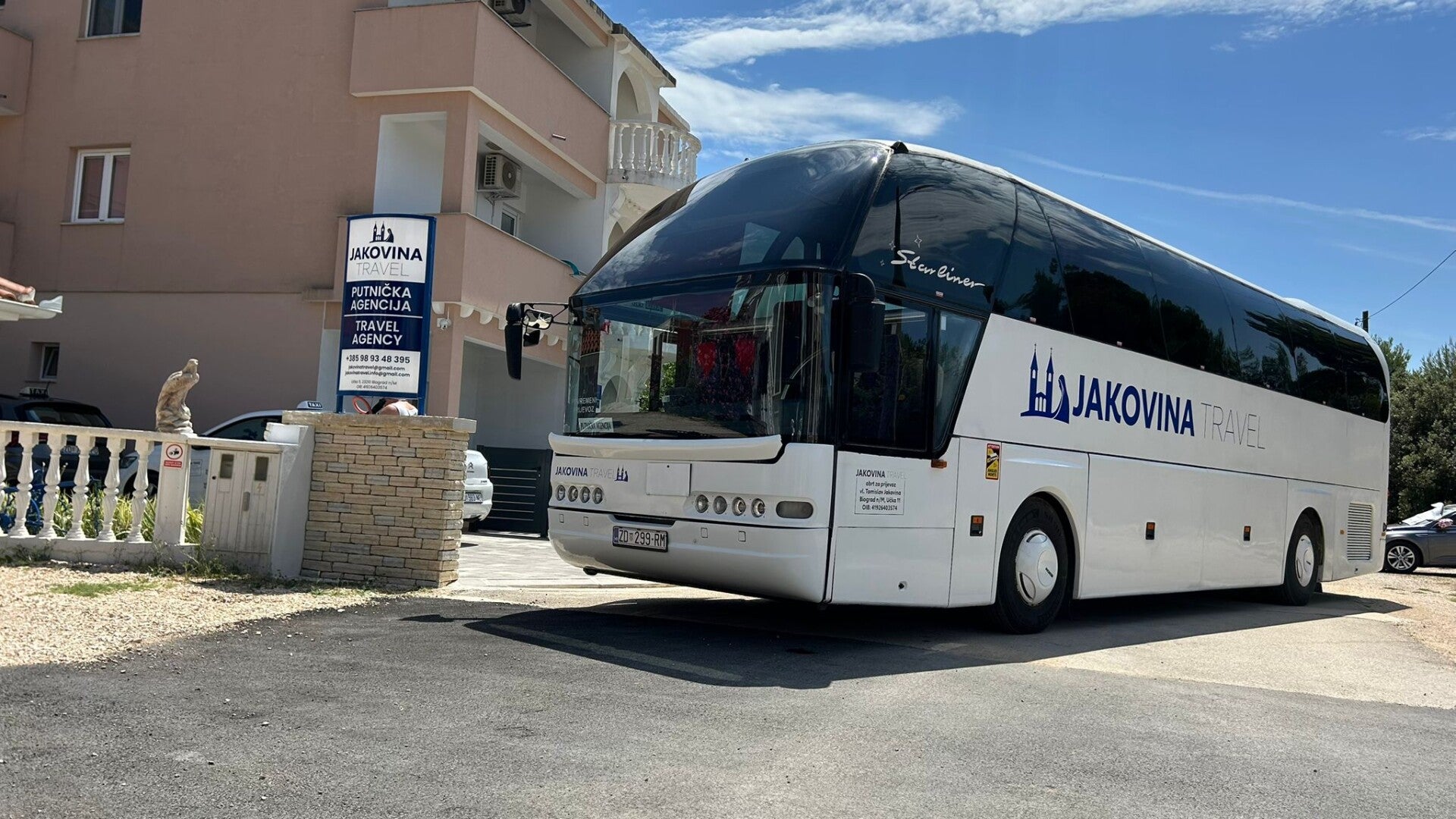 Official tour bus of Jakovina Travel Agency parked in front of the office in Biograd na Moru. [1]