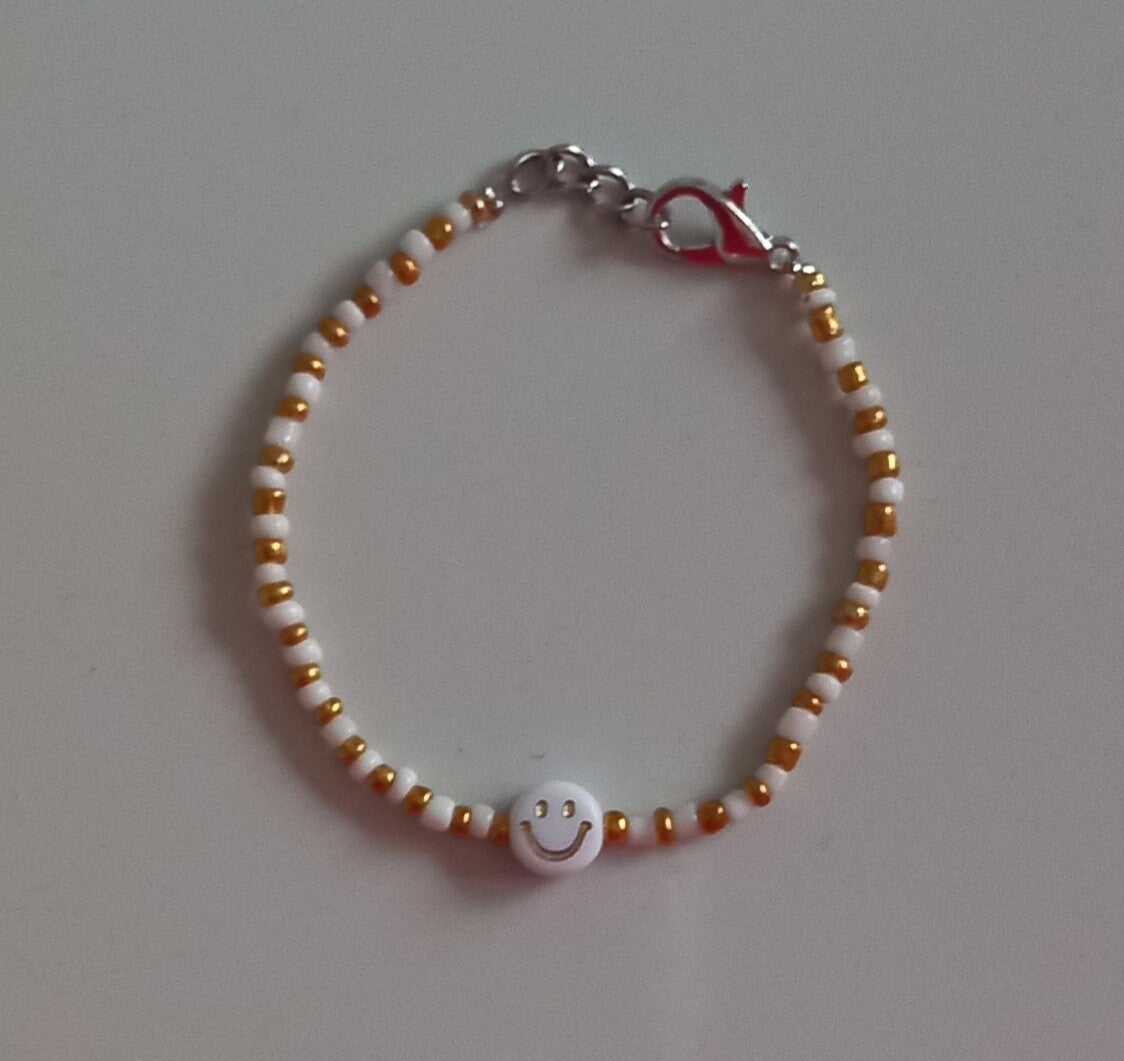 Gold smile armband