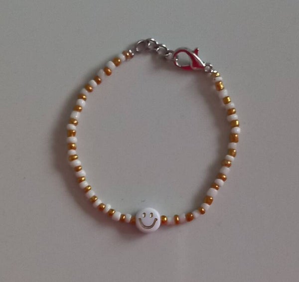 Gold smile armband