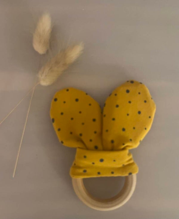 Bijtring knisper oortjes okergeel/ zwarte stip