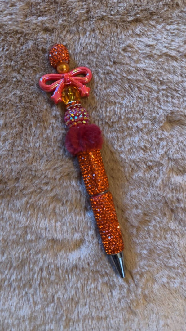Orange rhinestones • Pink bow • Pom-pom