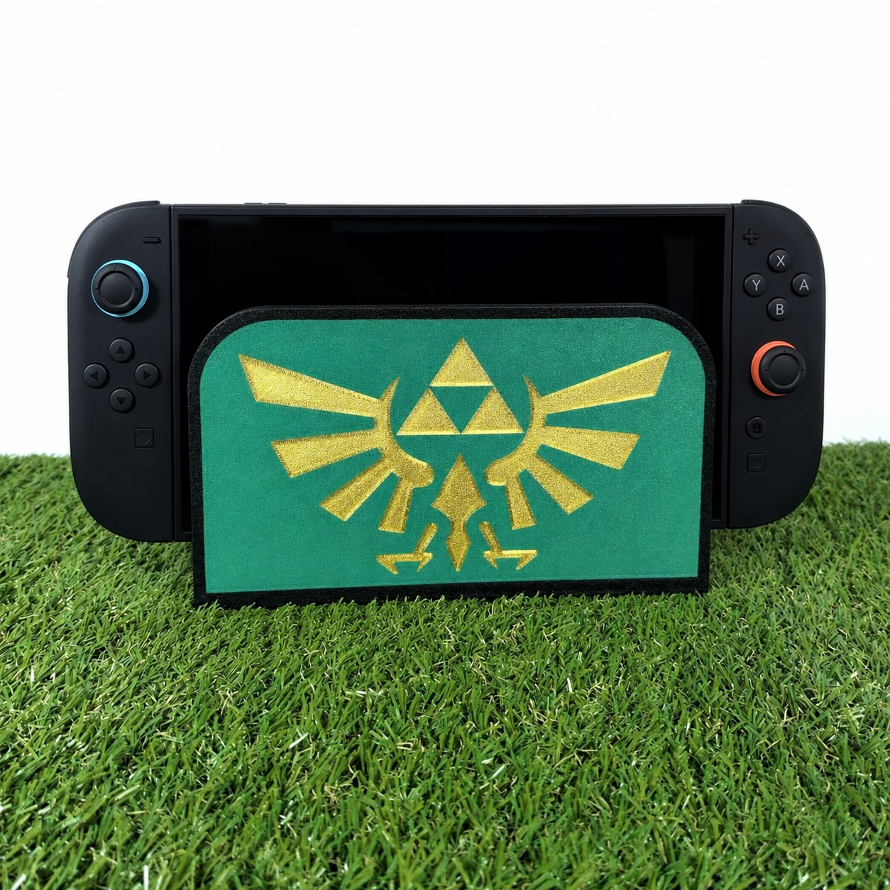 SOPORTE NINTENDO SWITCH 2. EMBLEMA HYRULE ZELDA