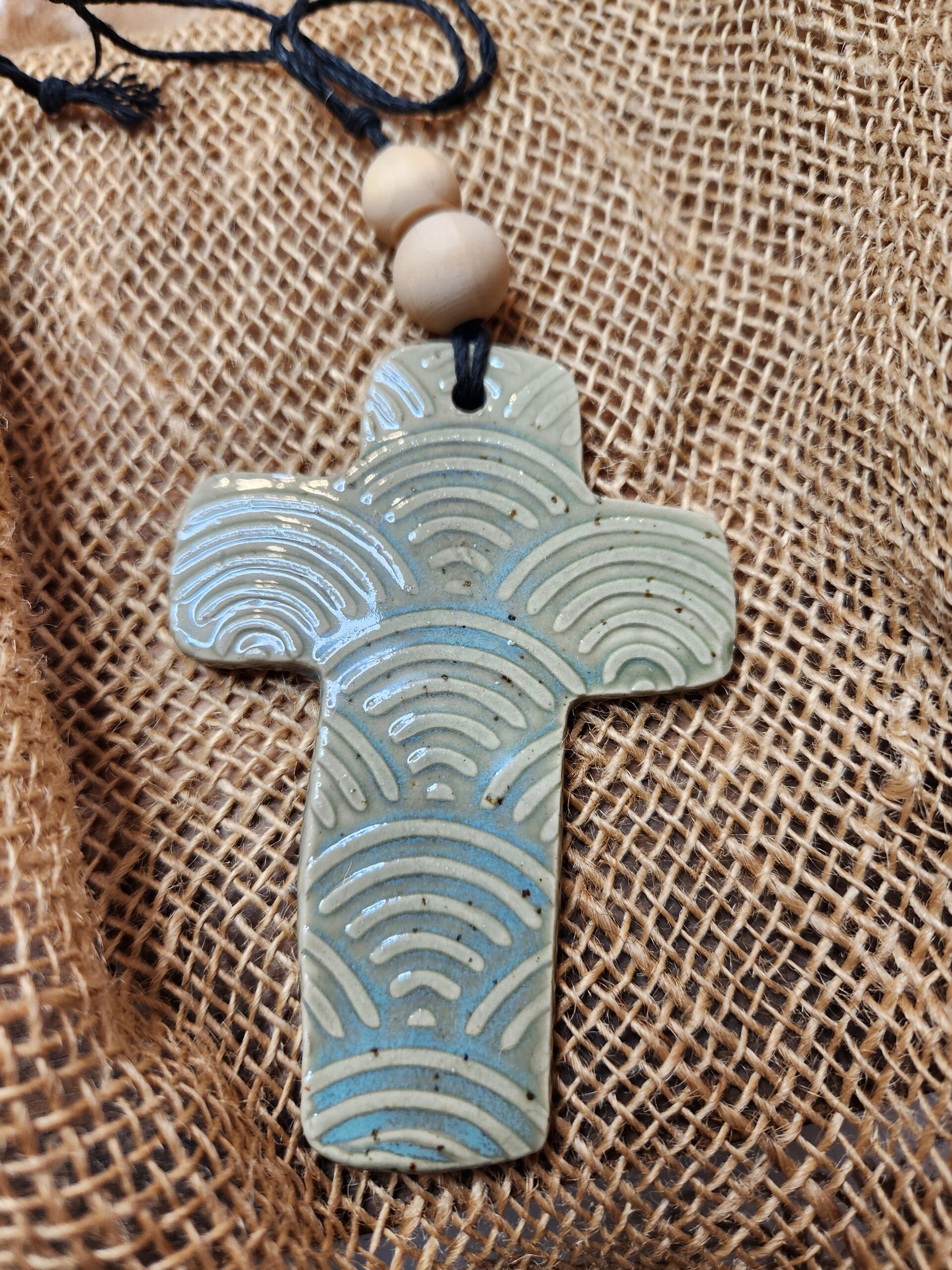Green rainbow cross pendant