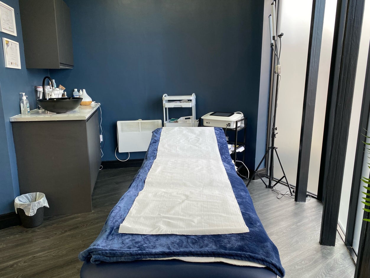 Treatment room with sink and clinical setup at Pulsar Laser Studio Chorley