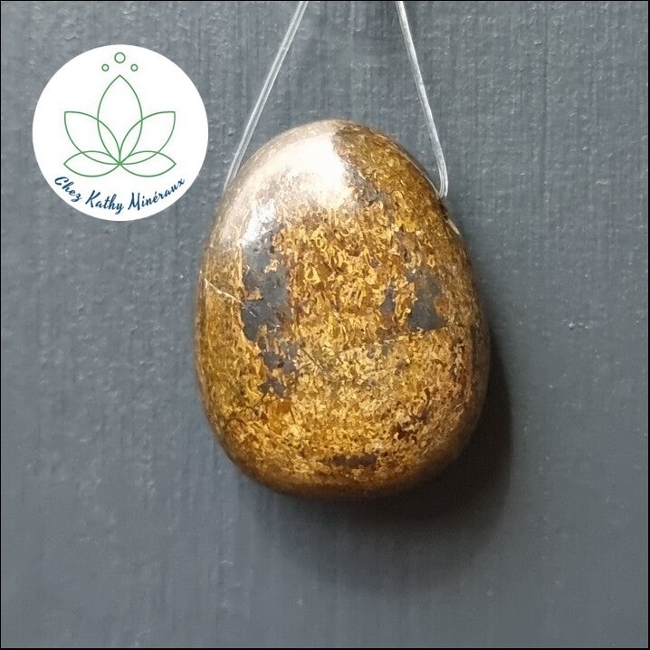 Pierre percée Bronzite