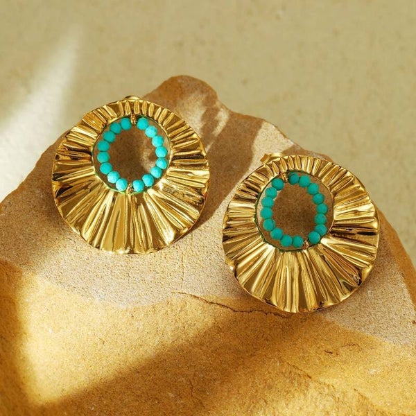 Boucle d’oreilles avec des perles bleue