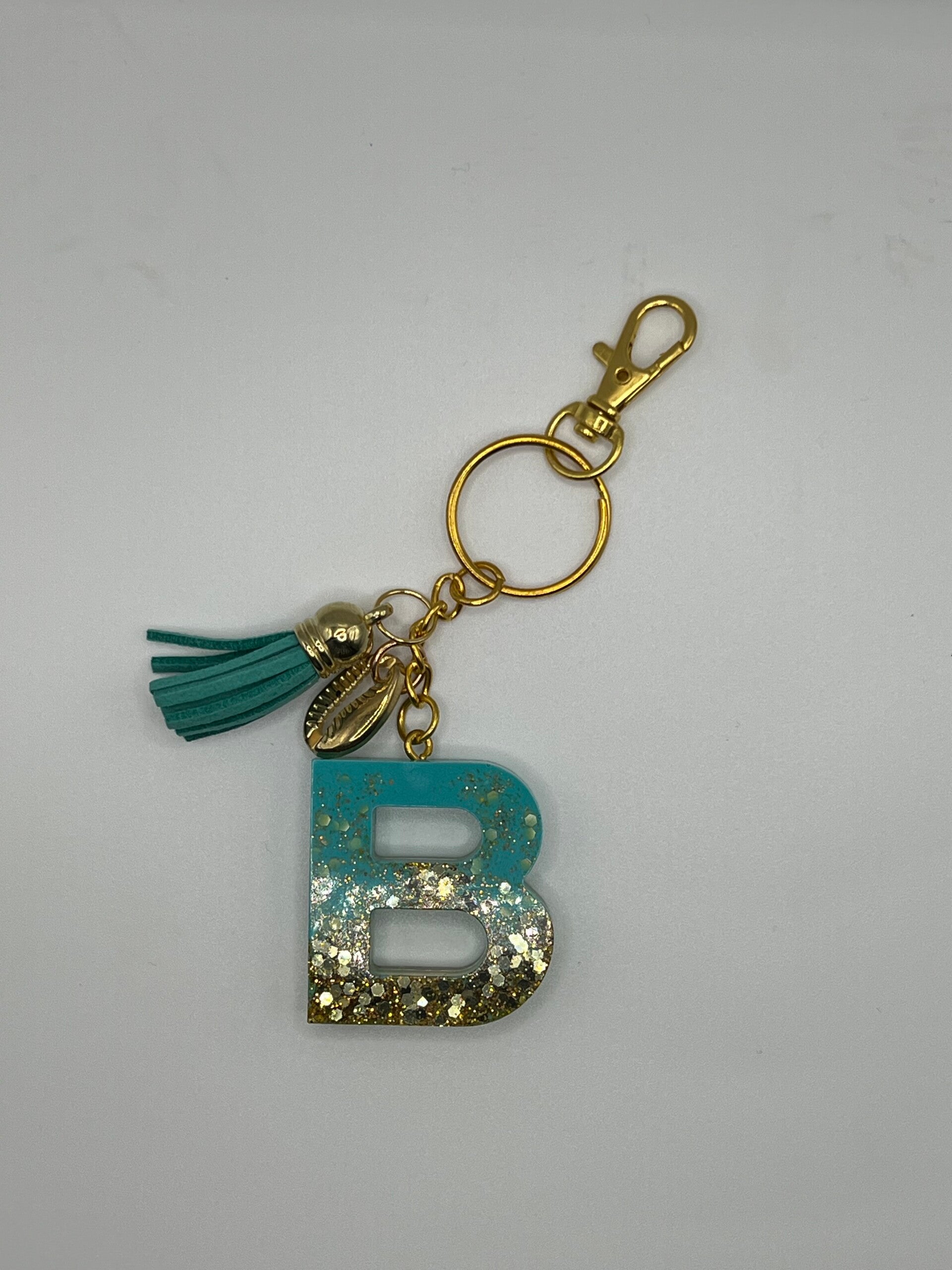 Sleutelhanger B turquoise/goud