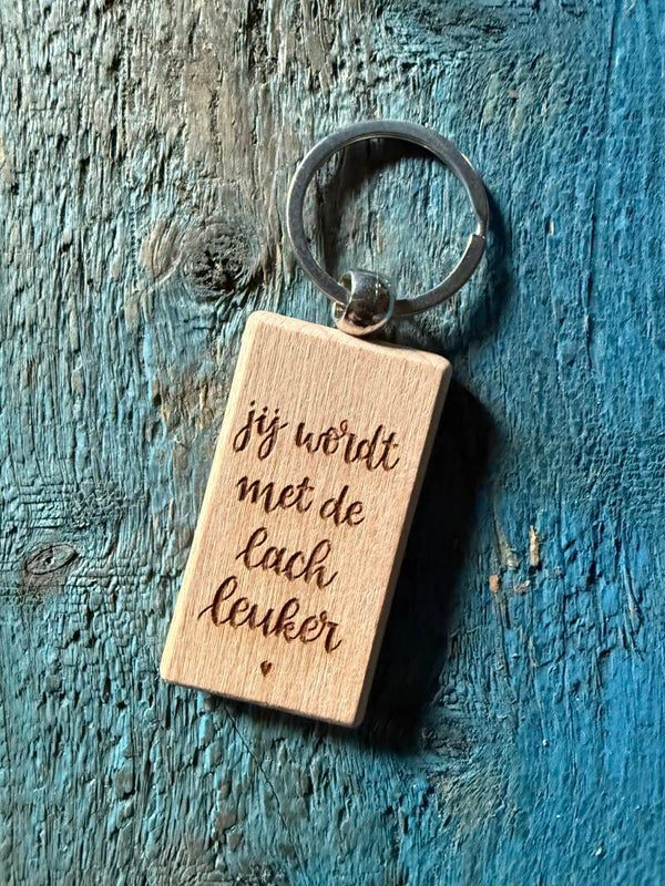 Sleutelhanger: Jij wordt met de lach leuker