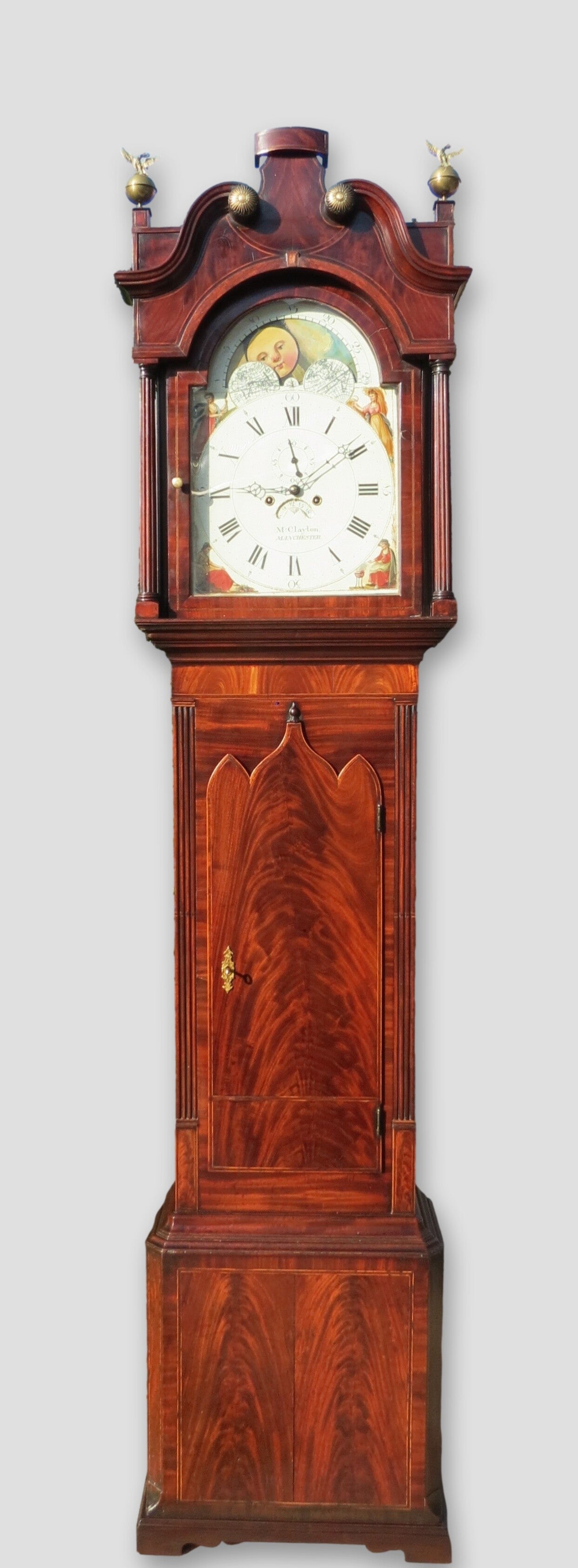 Martin Clayton, Manchester. Circa 1815. A large and impressive Manchester longcase clock with moon-phases and top quality flame mahogany case.