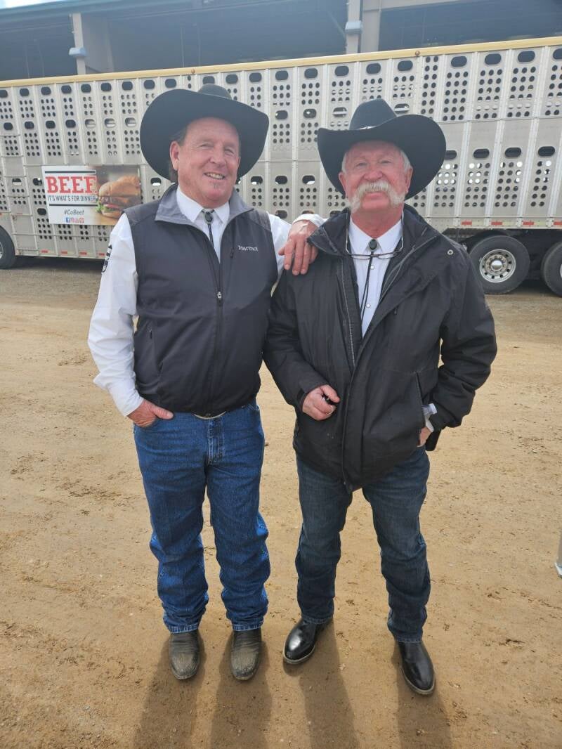 Two posse members posing at an event.