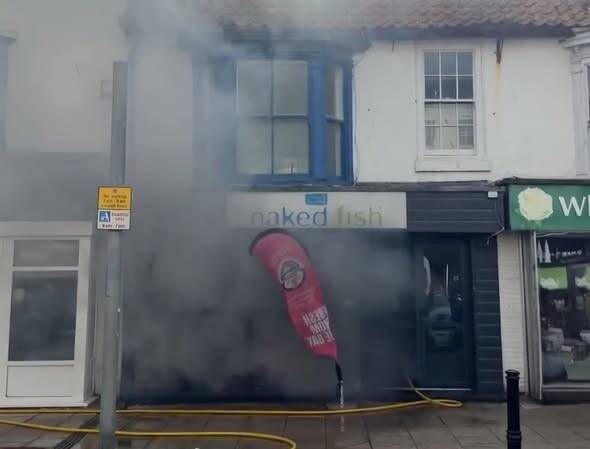 Firefighters tackle smoke pouring from Naked Fish restaurant on Queen Street, Bridlington.