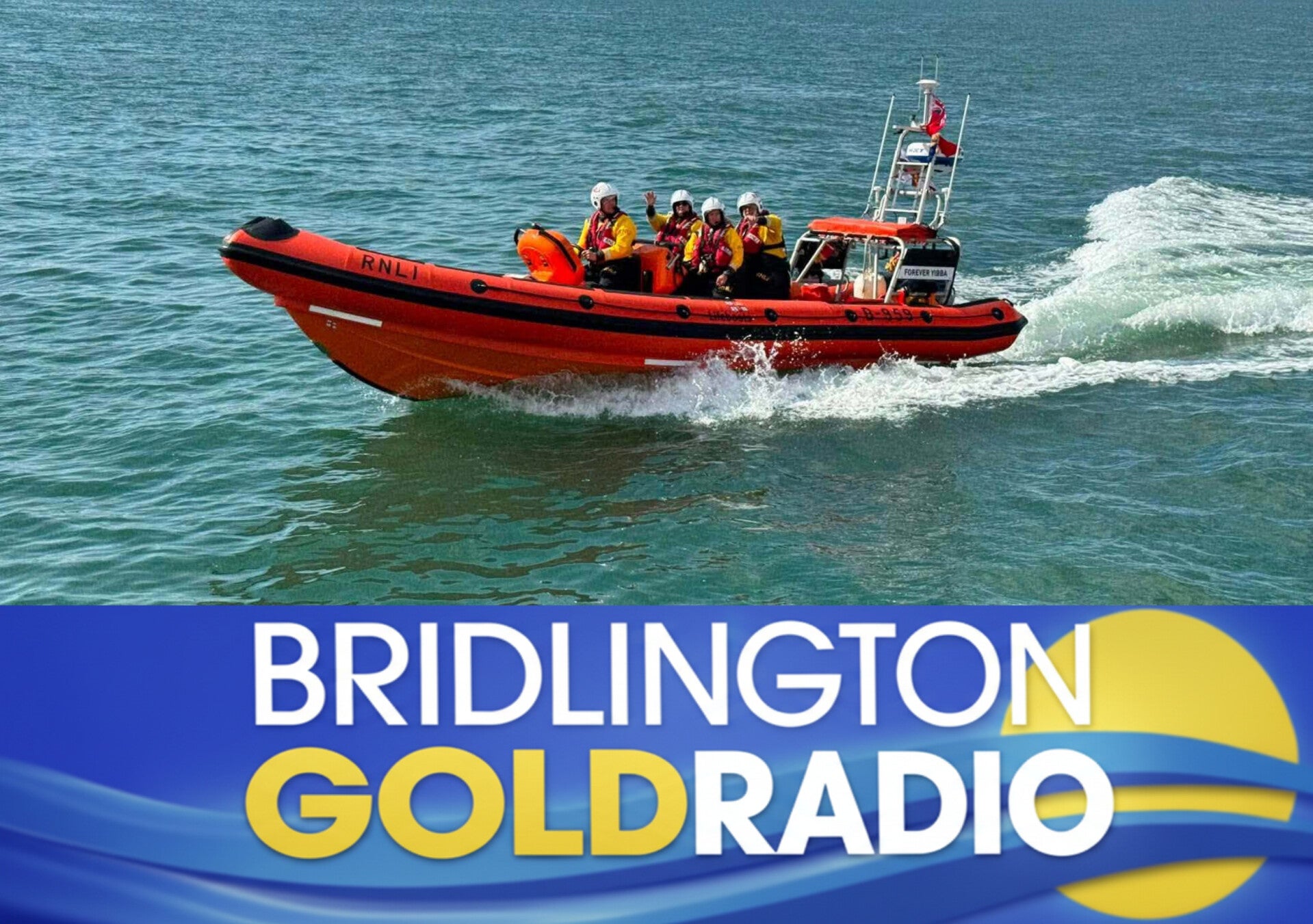 Flamborough RNLI lifeboat Forever Yibba (B‑959) carrying volunteer crew across calm waters near Bridlington