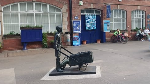 Bridlington’s five-foot bronze Barrow Boy sculpture now stands under fully operational station clocks.