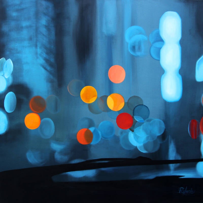 bokeh schilderij blauw oranje gezien vanuit de auto