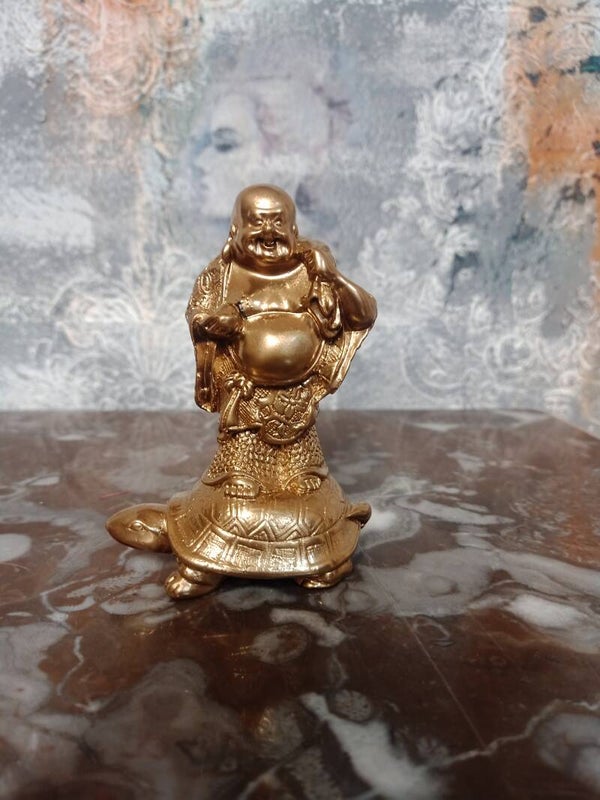 Golden budha with turttle
