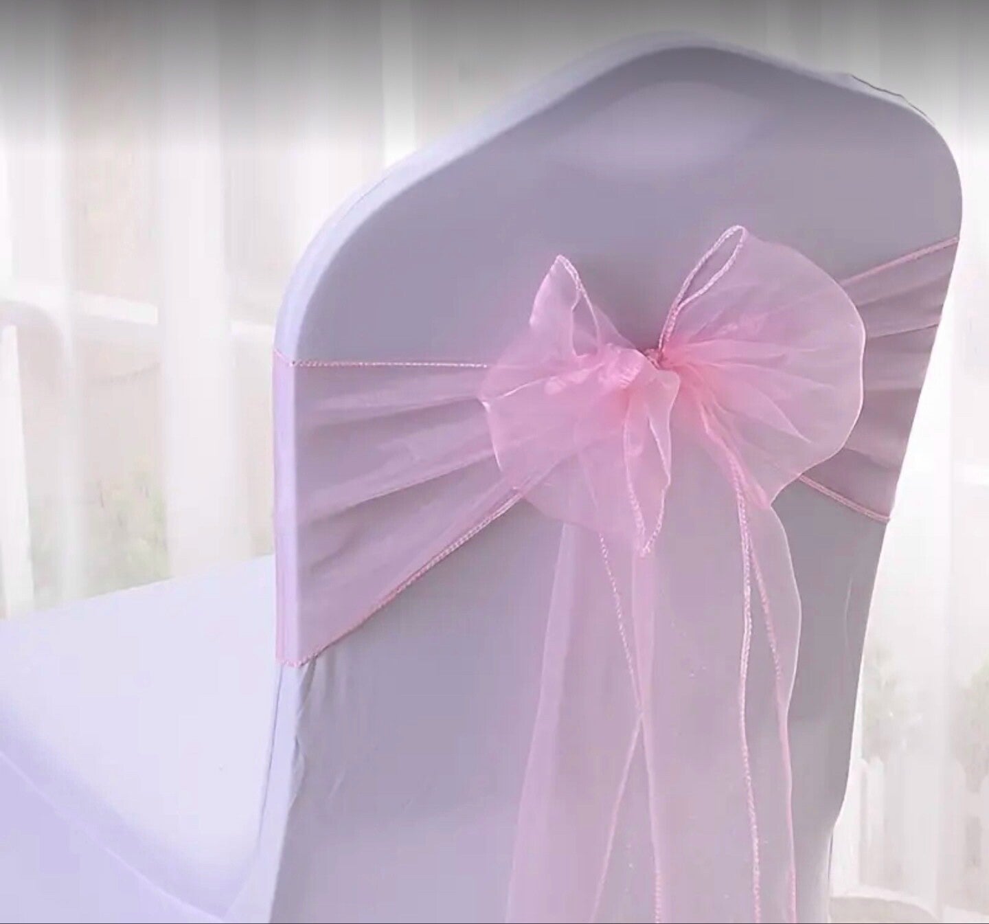 Noeud en organza rose clair