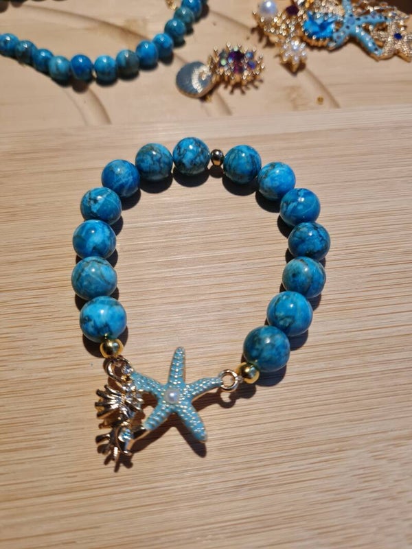 Bracelet 396 étoiles et coquillages