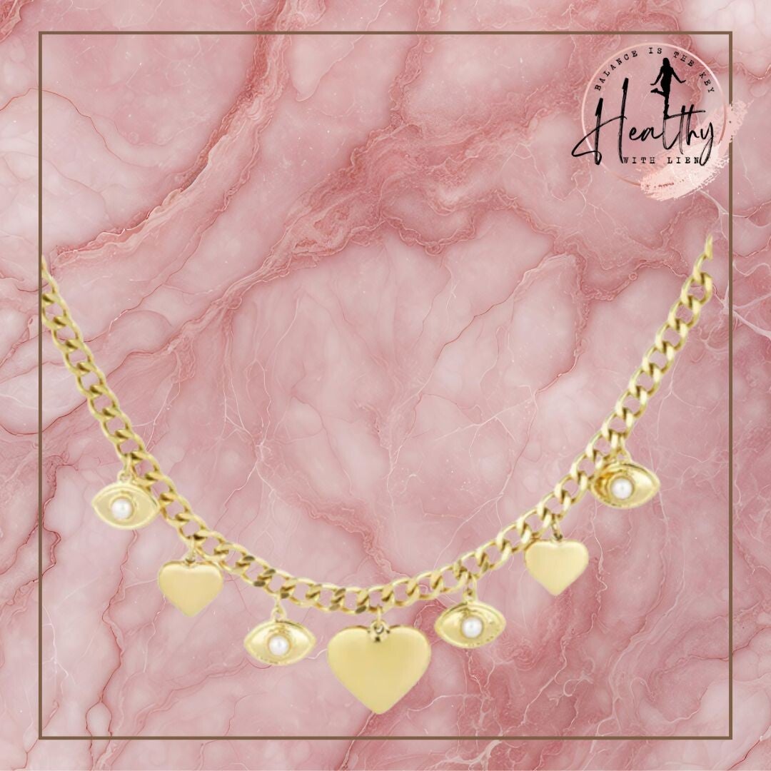 Gouden ketting met hartjes en oogjes