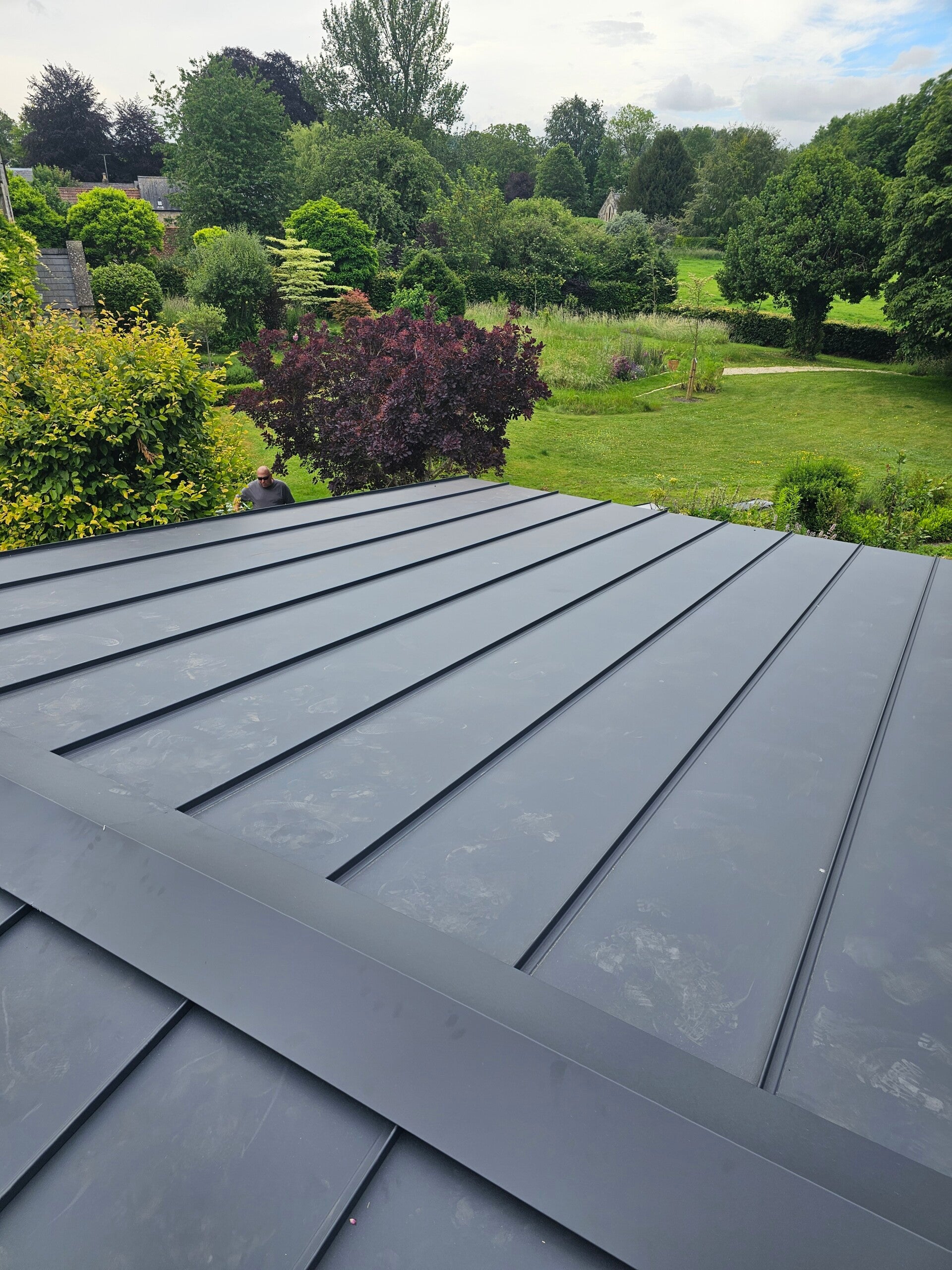 Standing seam sheet metal roof installed by CJB Roofing