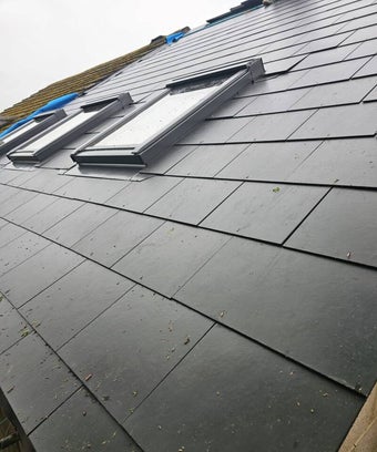 Windows in roof - velux windows - bring in day light - black window on a slate roof - rafters - scaffolding - salisbury wiltshire