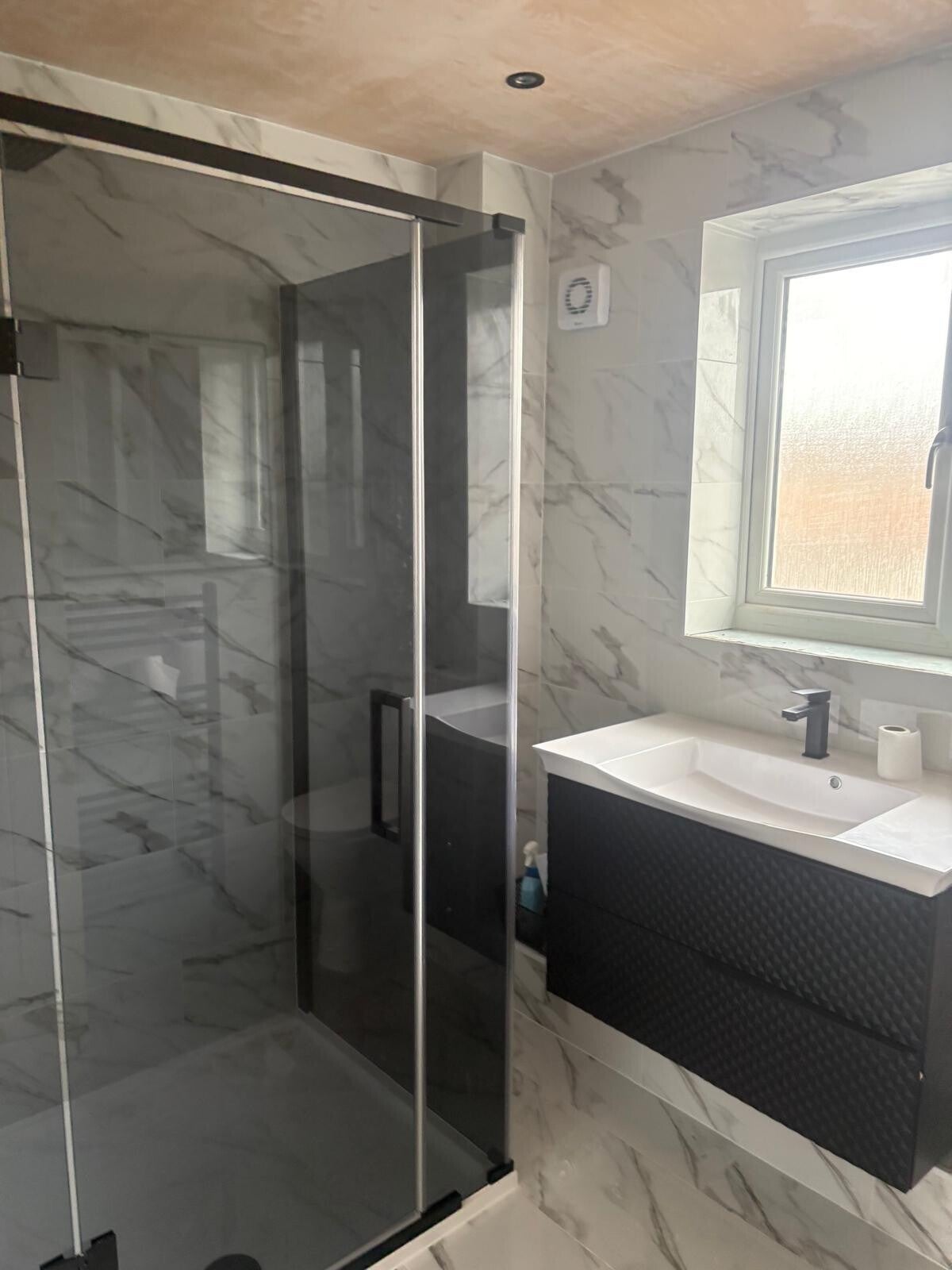 Bathroom renovation featuring modern shower and tiled wall finishes in Rubery