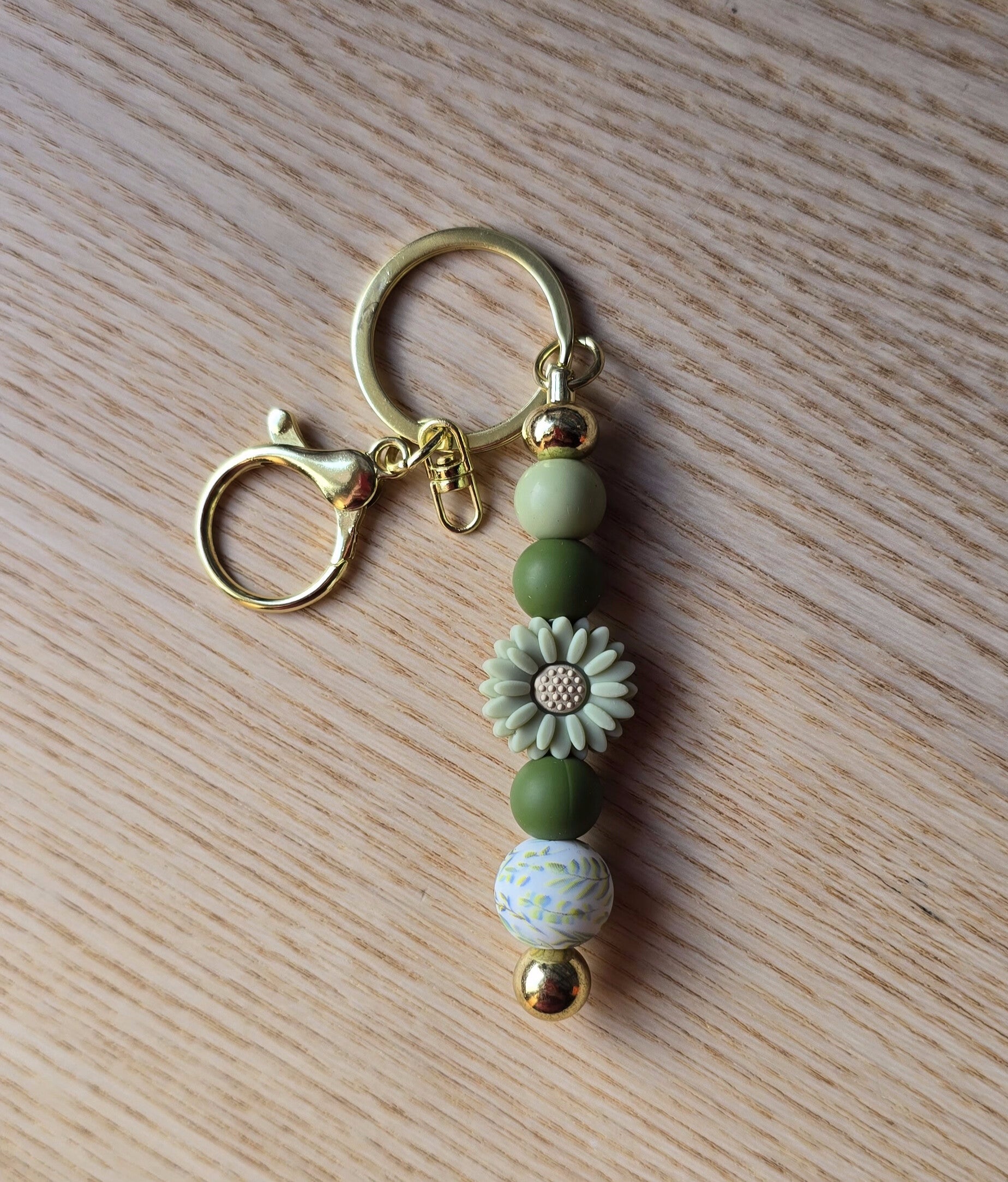 Porte-clés métallique ptite fleur verte