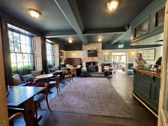 Main bar and fireplace at The Pelican in Chew Magna