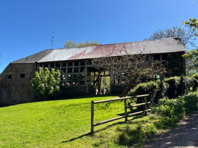 Medieval barn at Llanvihangel Court