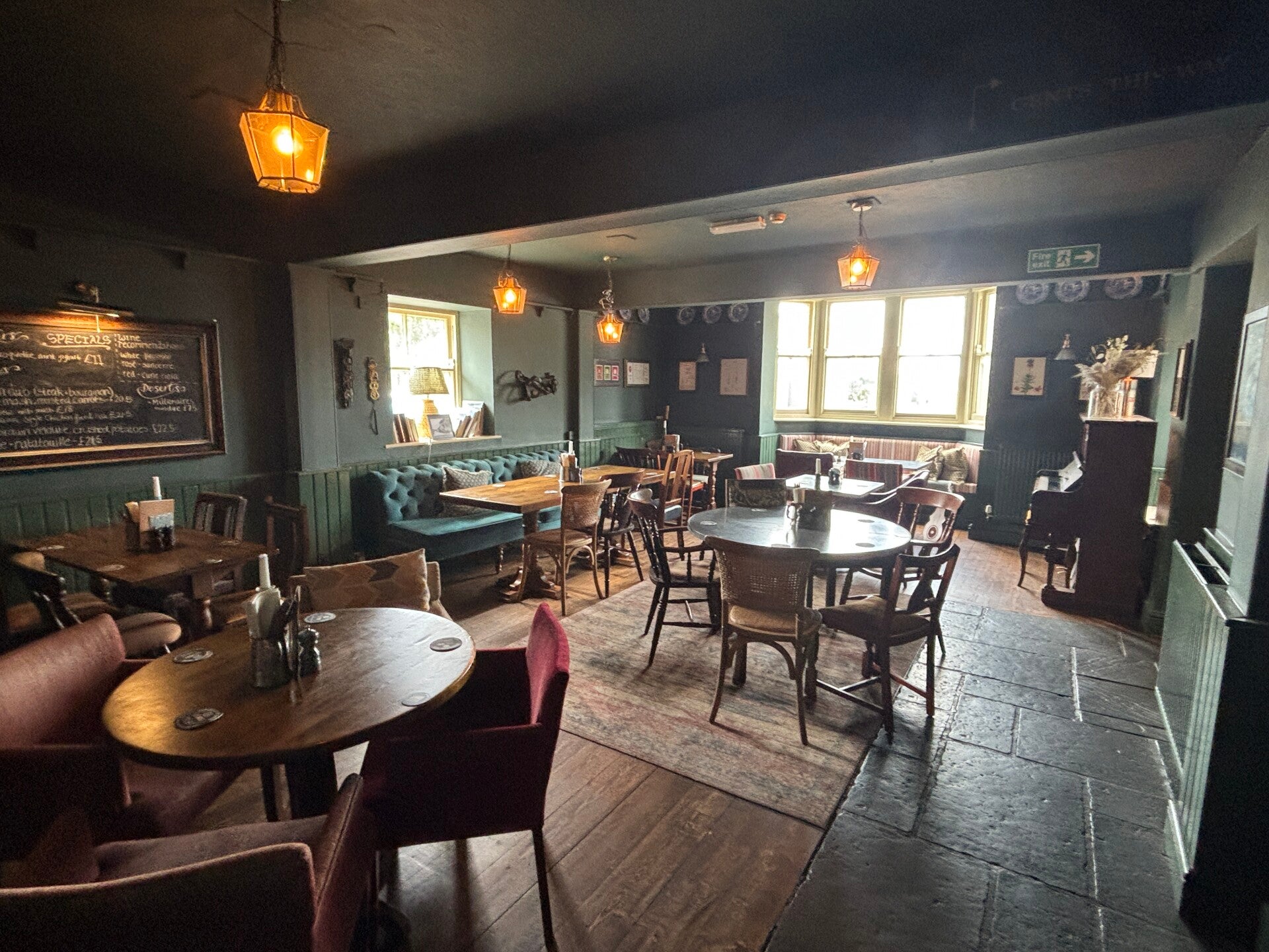 Rear seating area and piano at The George at Backwell