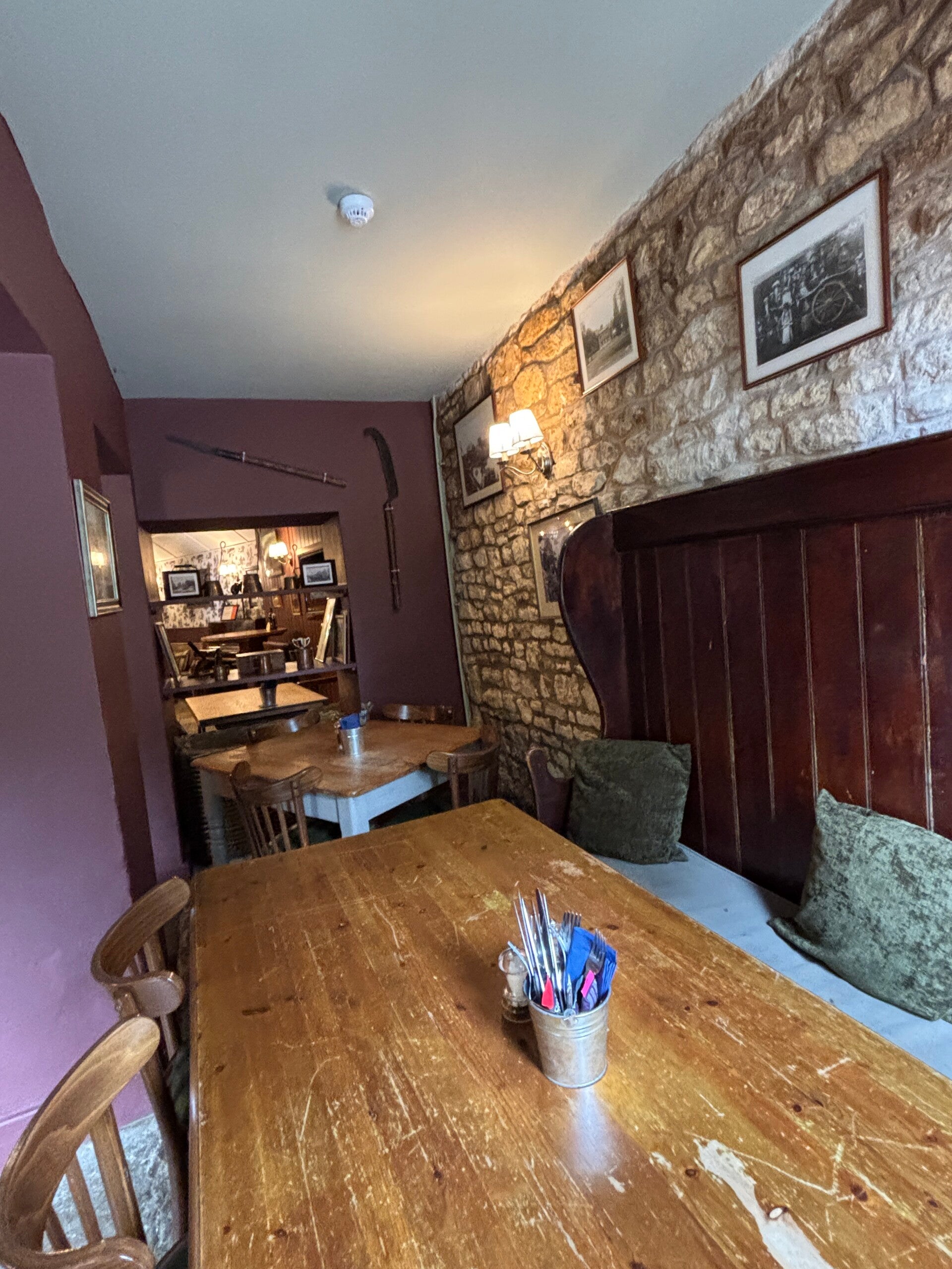 Dining tables in the main bar at The Farmers Arms in Guiting Power
