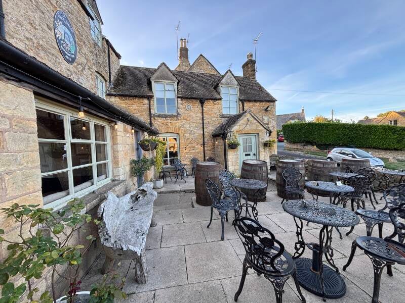 Outdoor seating at Coaches and Horses in Longborough