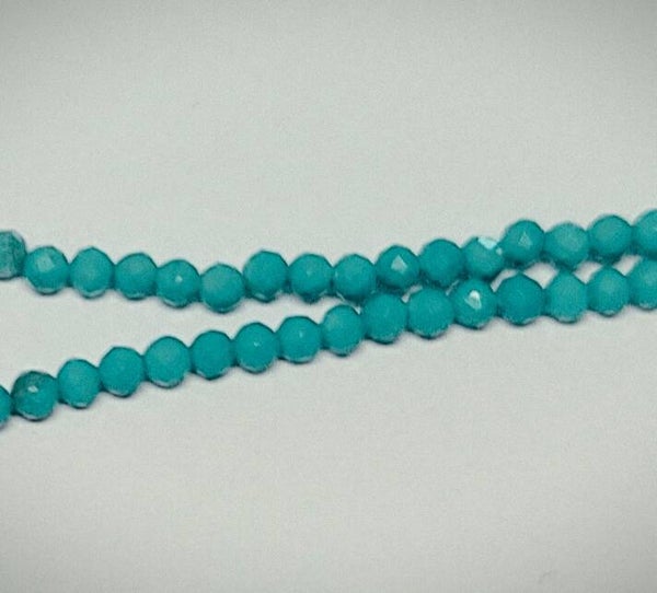 2mm faceted Howliet Turquoise     per 50 stuks