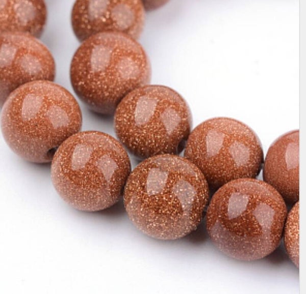 8 mm glad rond synth. Goldstone   per 5 stuks