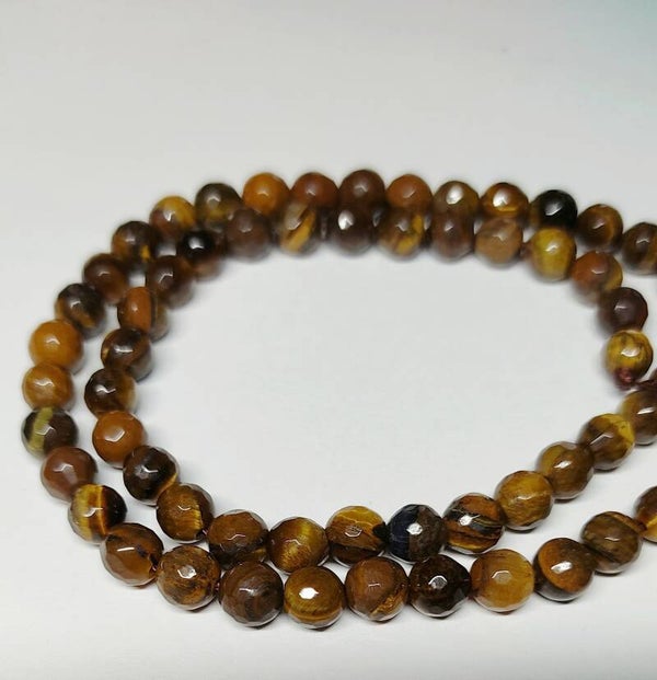 6 mm faceted Tiger Eye             per 10 stuks