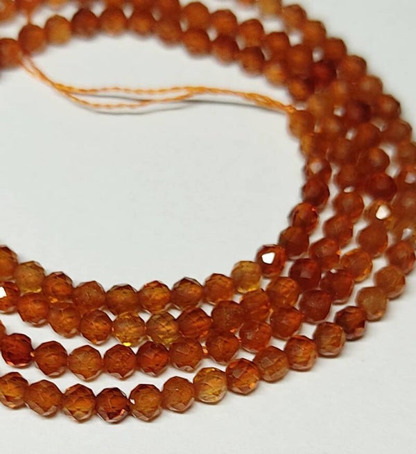 2mm faceted Granaat Oranje     per 50 stuks