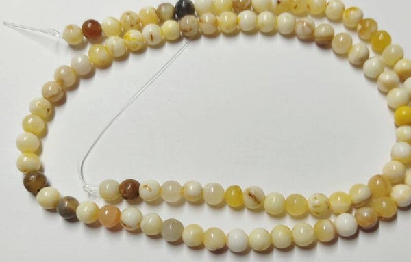 4mm *streng* glad rond Yellow Jade