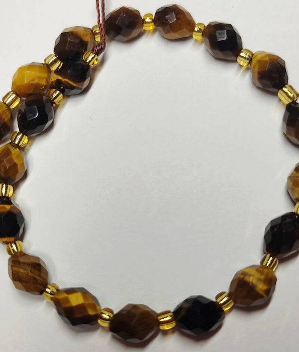 Ovaal 9x8 faceted Tiger Eye.   Per stuk