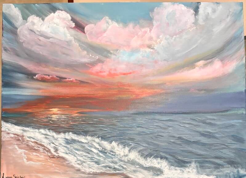 An ocean dusk opens into a sky filled with soft, glowing clouds and a wash of warm pinks ,corals, and gentle blues. The waves move to the shore with a quiet rhythm, catching traces of light as the sun sinks into the horizon. There's a sense of breath ...