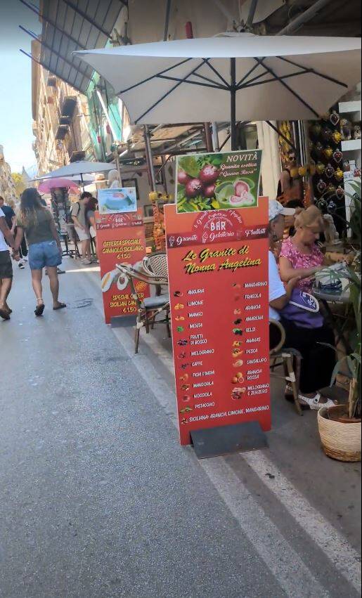 Cheap tourists signs advertising food in Palermo