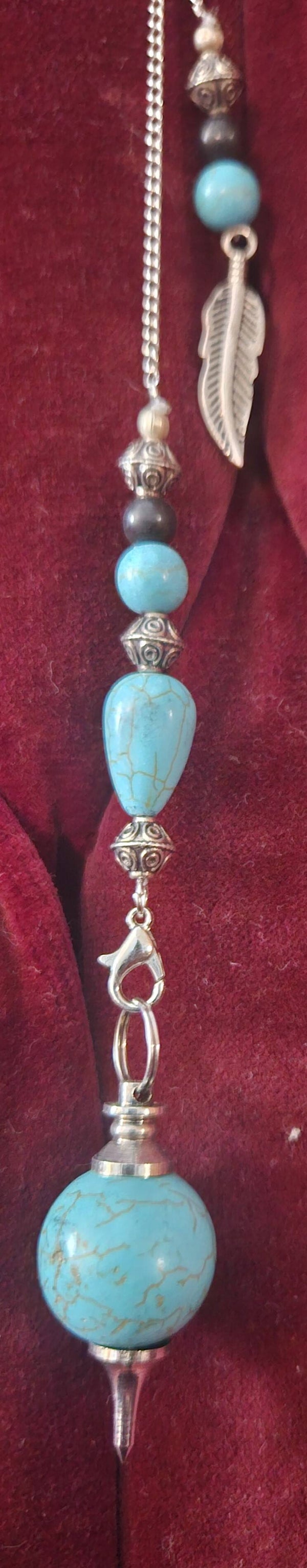 RECONSTITUTED TURQUOISE W/STERLING SILVER FEATHER & CHAIN