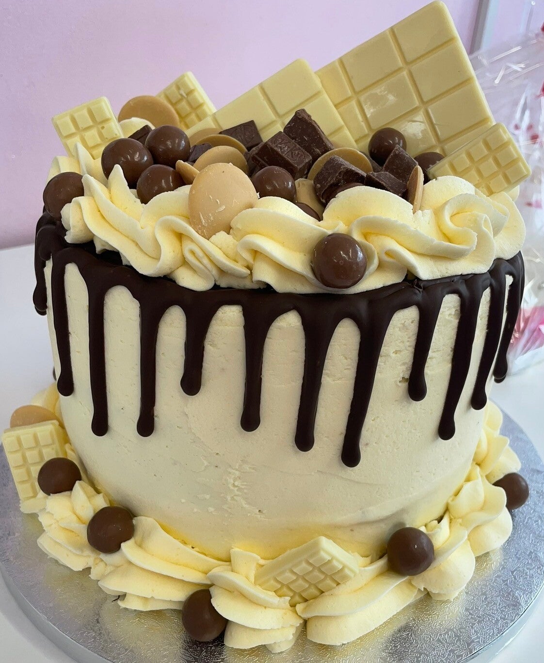 Malteser and white chocolate drip cake