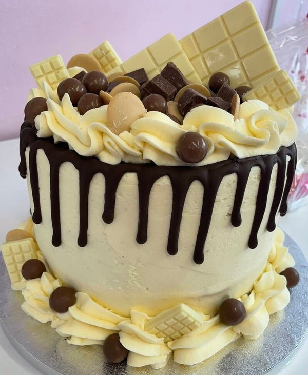 Malteser and white chocolate drip cake