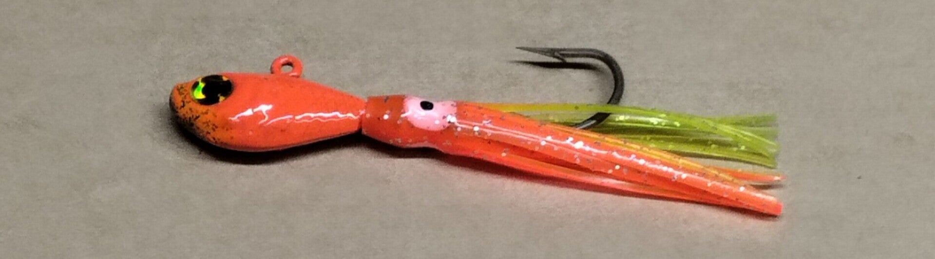 boat jig 18.5 gms with random colour squid skirt orange