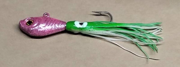 boat jig 55 gms speckled pink with squid skirt eye colour will vary