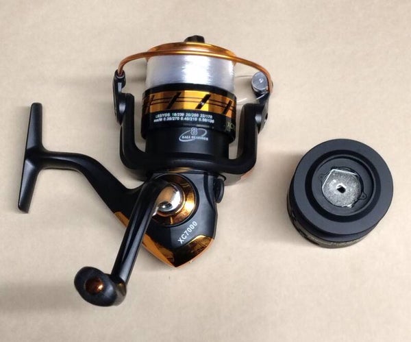 Light surfcasting reel ( new) xc7000 reel loaded with line and spare spool