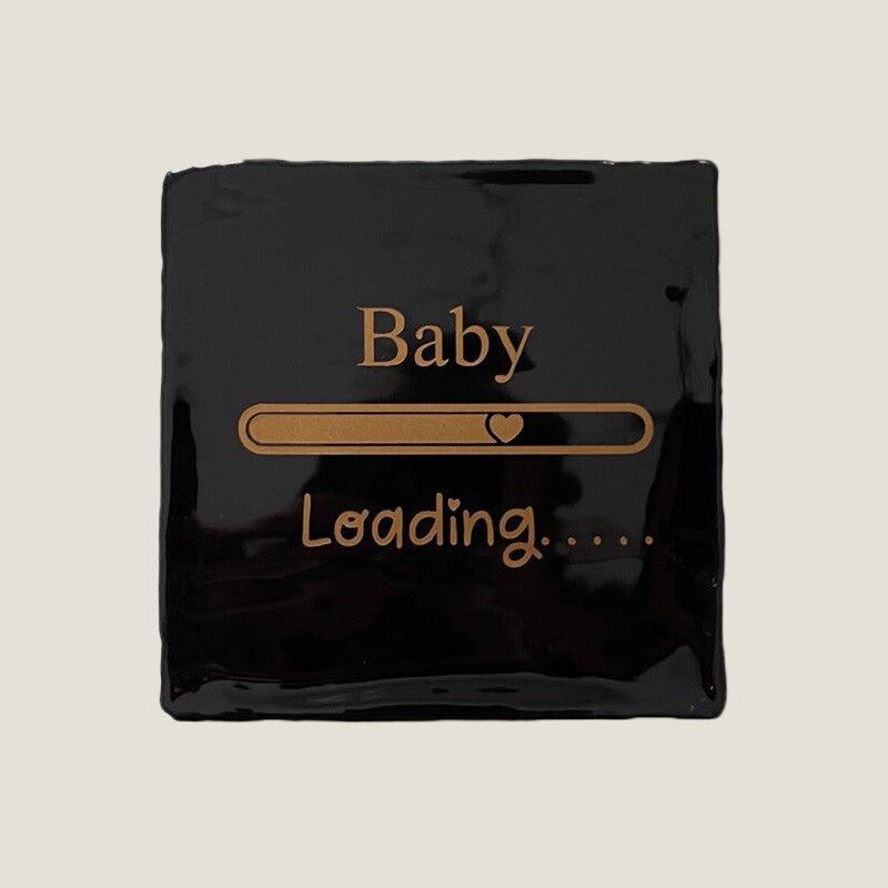 Tegeltje - baby loading