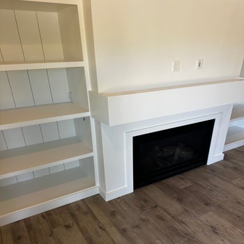 Complete fireplace remodel with shiplap, crown and shelves