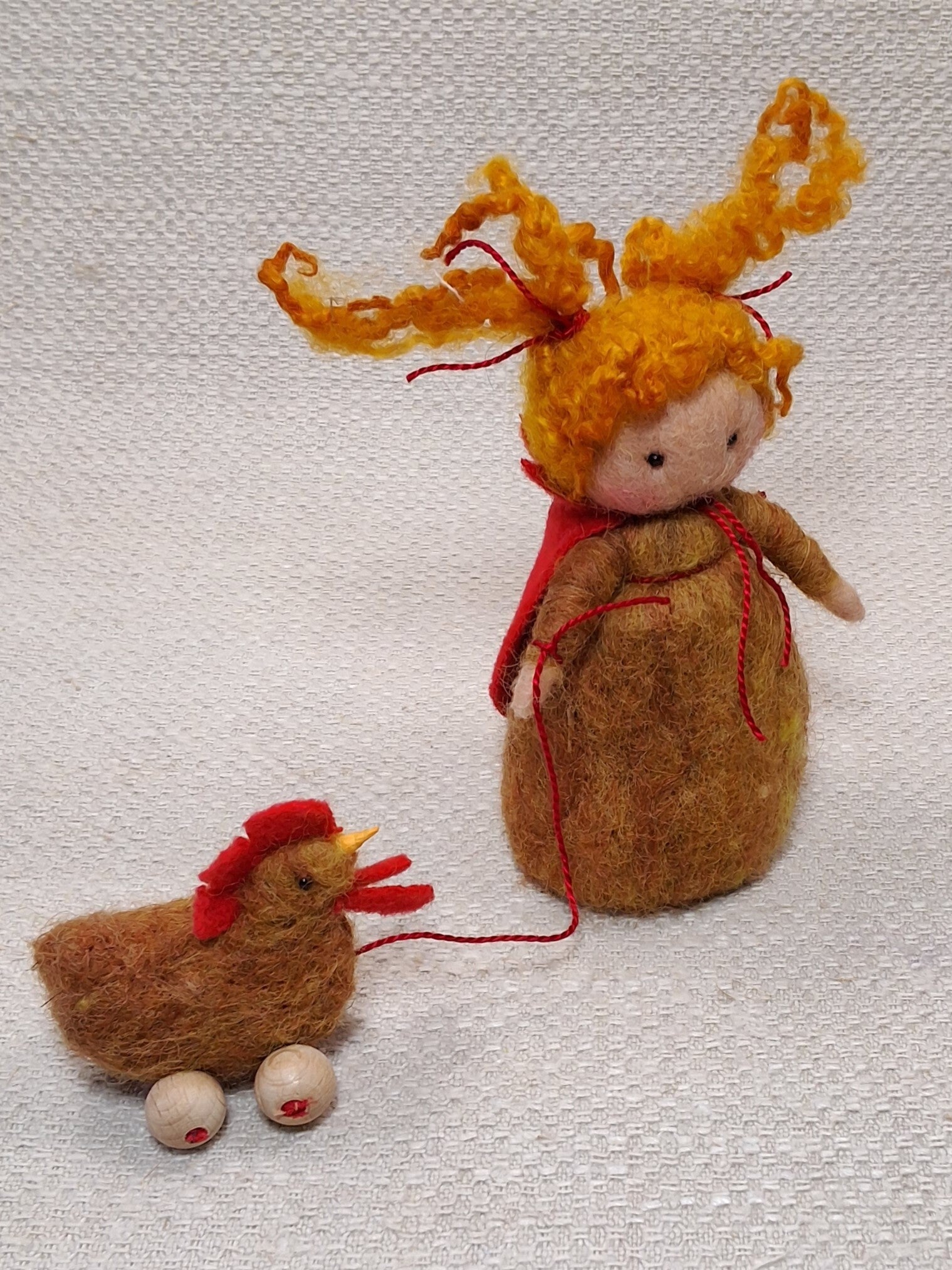 141. Naaldviltpopje met kipje
